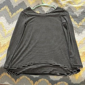 Black and white striped tee. Low round neck. Size: 10-12. Fit kids and juniors.